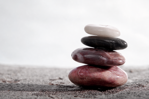 Four balanced stones in the Severus corporate colors